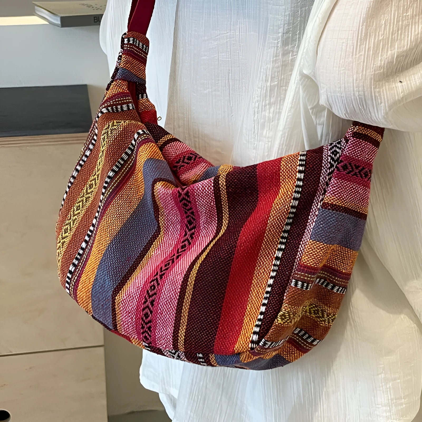Women's ethnic style canvas dumpling crossbody bag showing sewing thread details and large capacity design