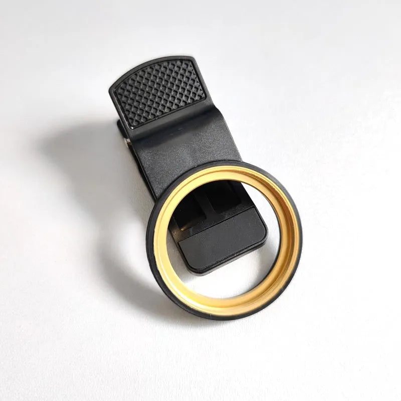 37mm universal clip phone lens filter adapter with golden or black spiral teeth and large hole for screw-on filters.
