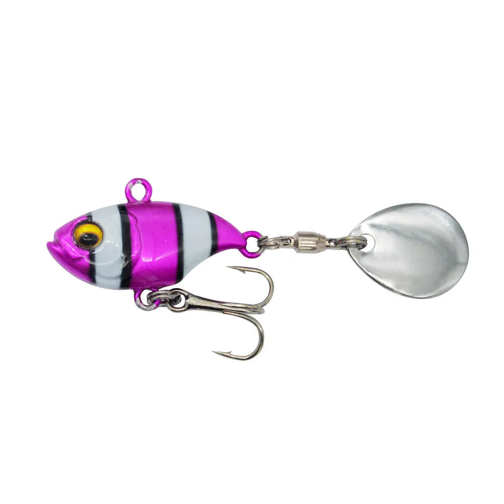 Gold metal fishing spinnerbait lure with a rotating sequin plate on a hook.