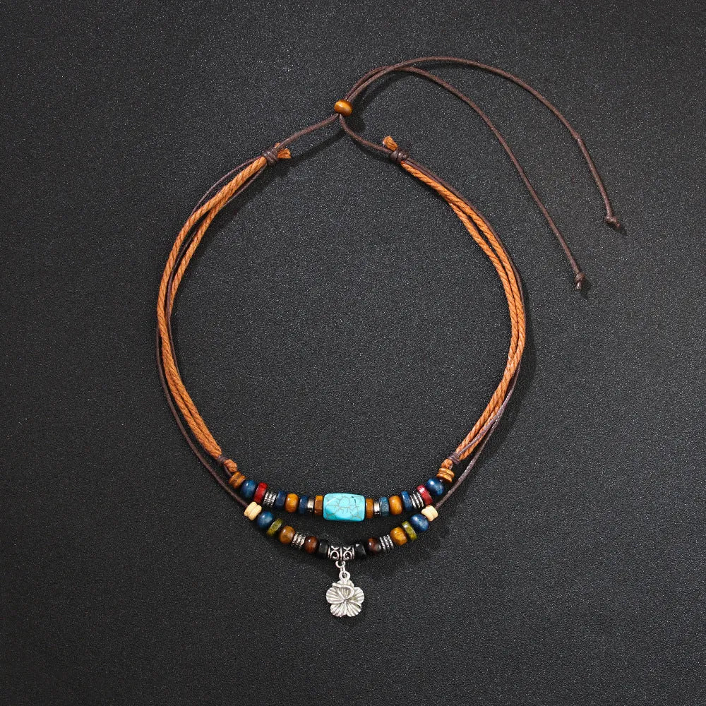 Turquoise wooden bead necklace with alloy geometric flower pendant on brown wax rope cord