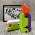3D printed plastic gravity carrot knife fidget toy in orange, purple, and green colours.