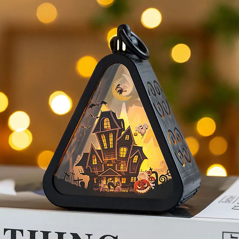 A portable Halloween pumpkin lamp decoration in one of four colour themes: pumpkin, witch, castle, or ghost hand.