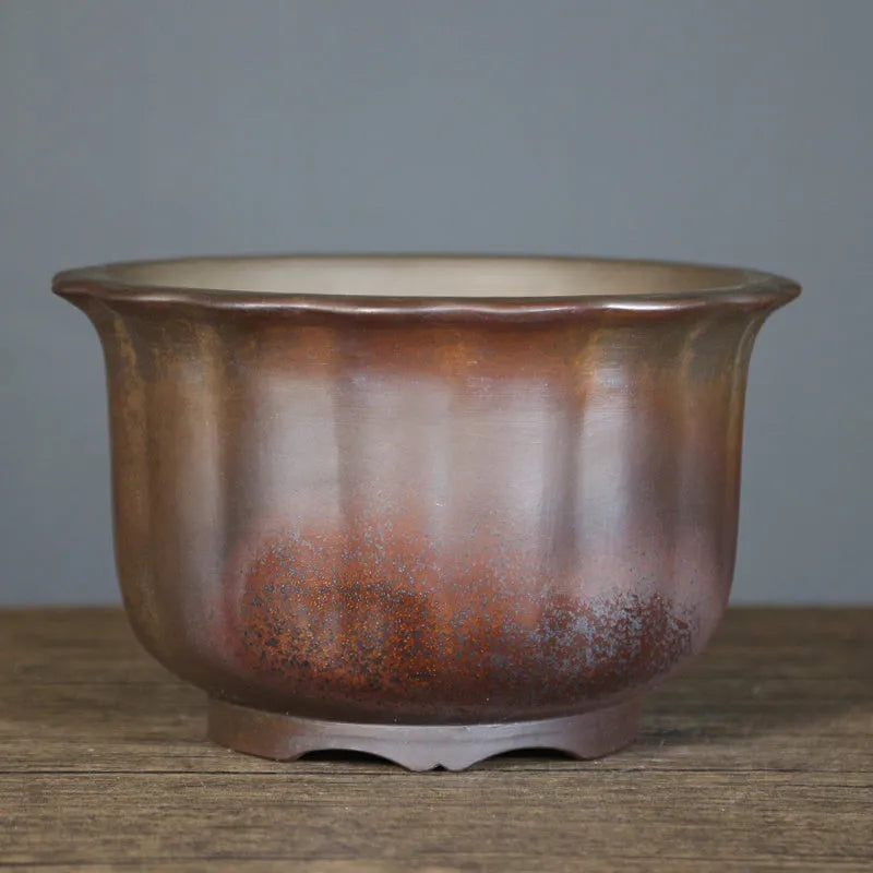 Antique carved purple sand ceramic bonsai pot in classical design for indoor plants.