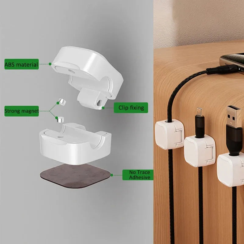 Black and white magnetic cable clips with adhesive backing for under desk cable management.