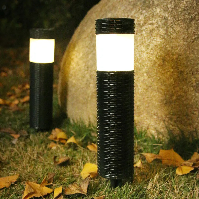 Modern abstract solar-powered outdoor garden light with waterproof casing.