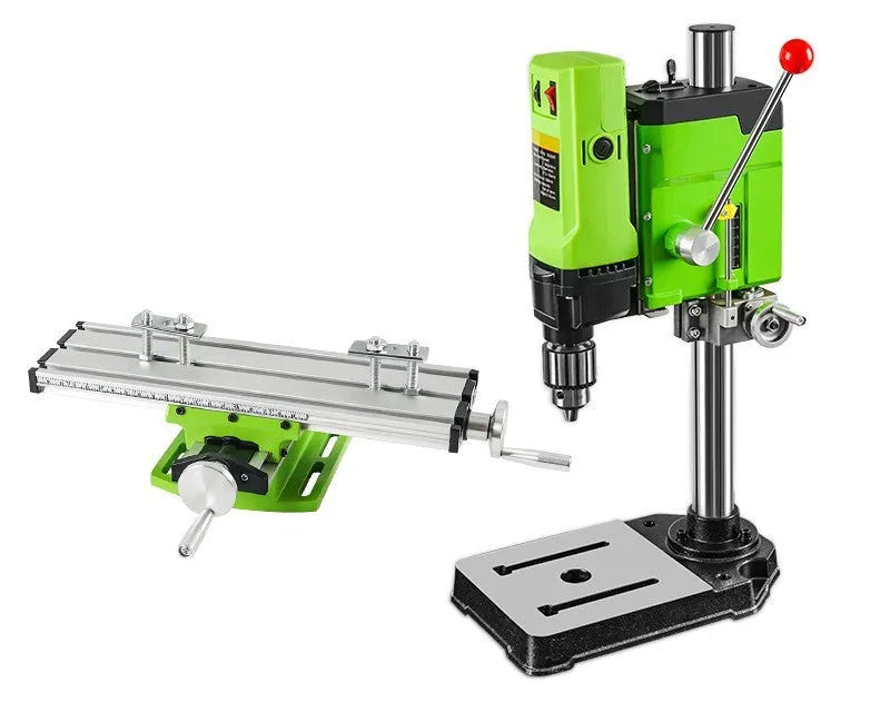 Mini bench drill milling machine on a workbench with optional pliers or drill accessories.
