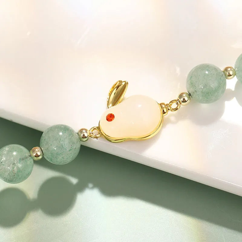 Adjustable rabbit charm bracelet with green aventurine or strawberry quartz stone beads and gold accents
