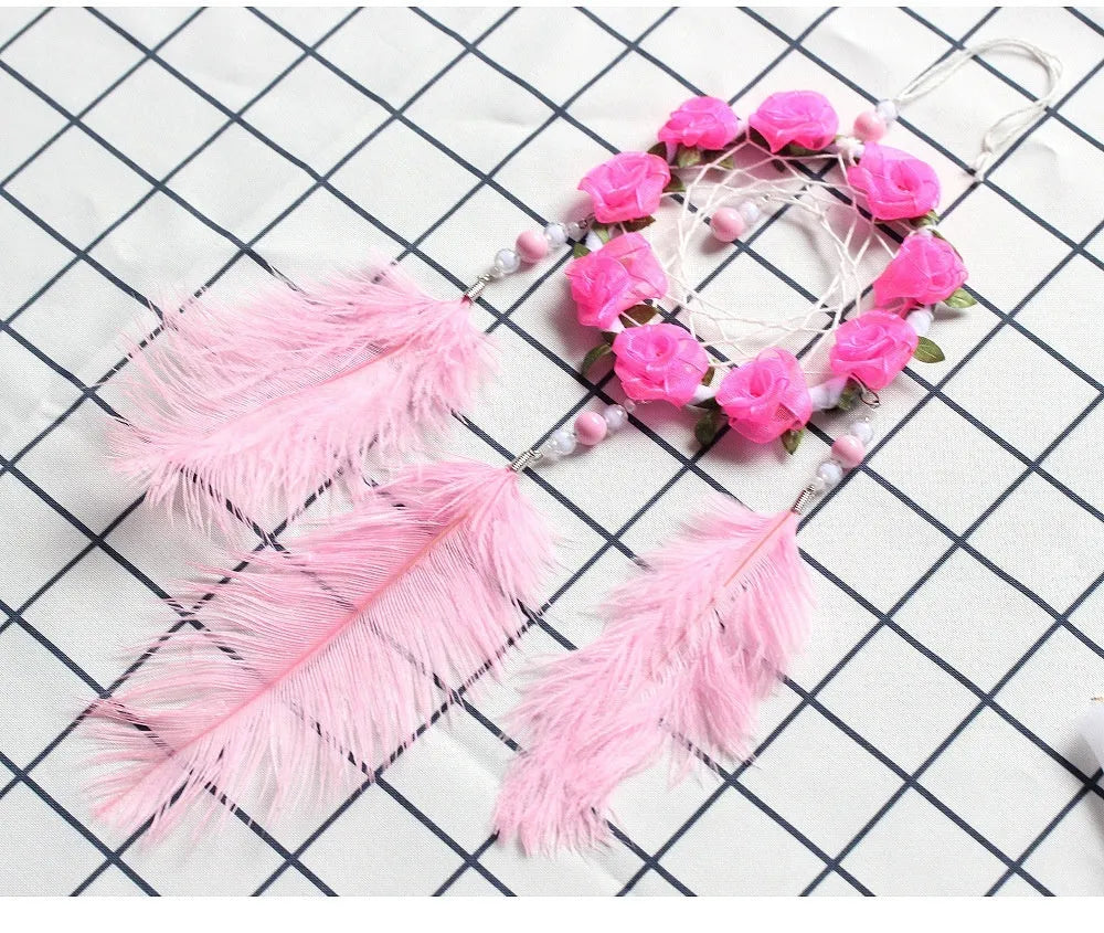 Pink ostrich feather dreamcatcher wall decoration ornament measuring 10cm.