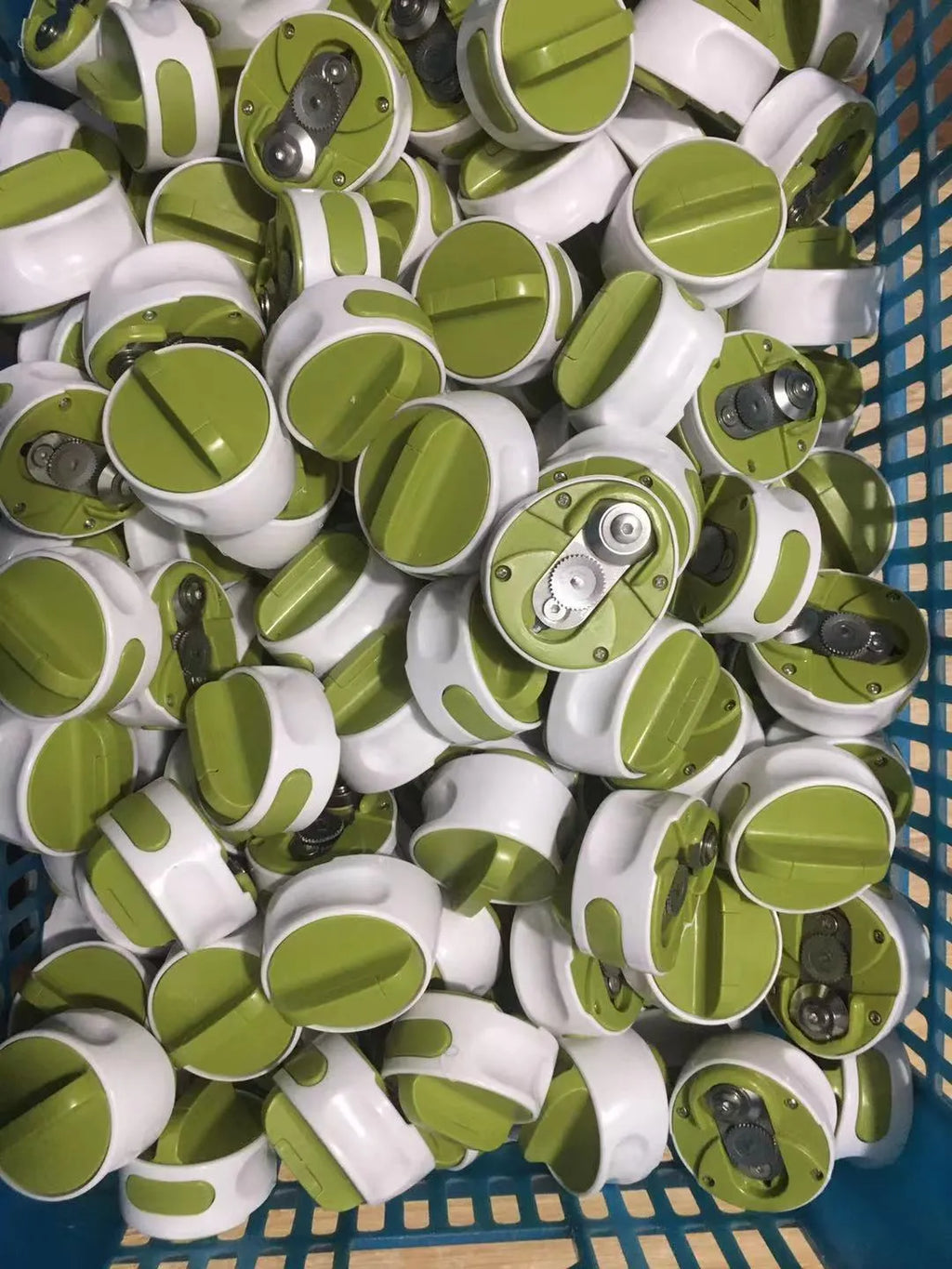 Green stainless steel bottle opener with screw mechanism for opening jars