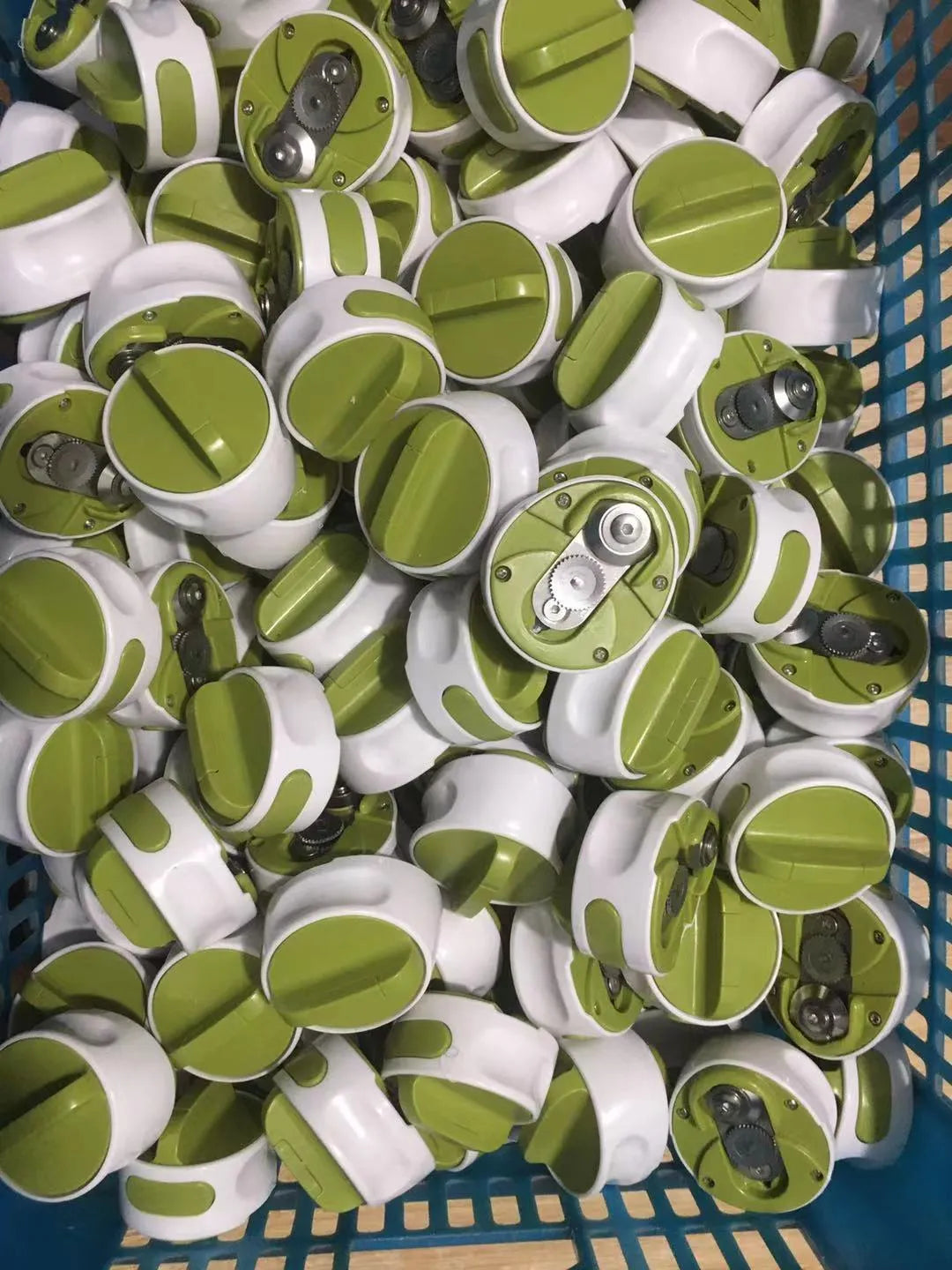 Green stainless steel bottle opener with screw mechanism for opening jars