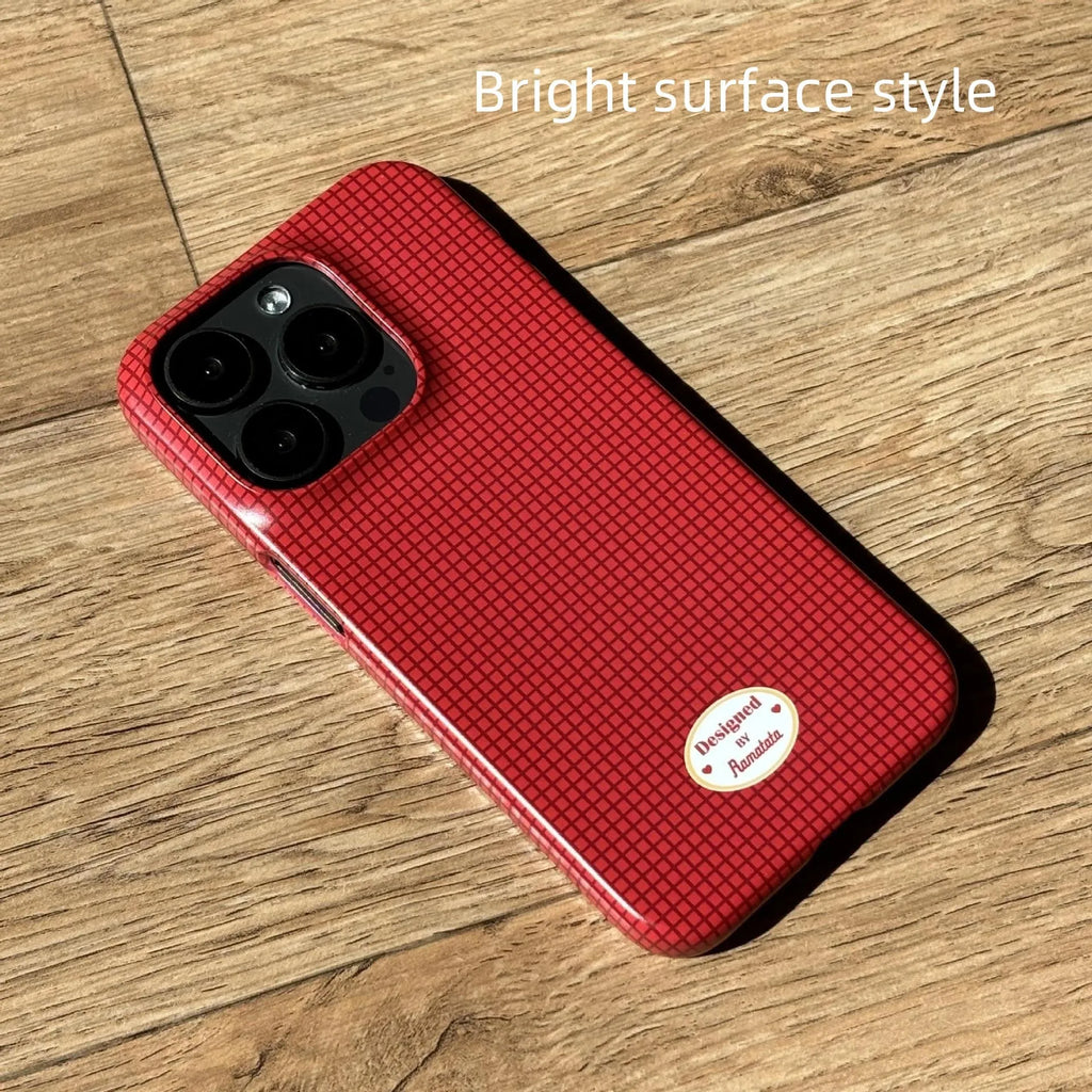 Original plain plaid design iPhone 15 Pro Max case in glossy red grid or frosted orange grid options.