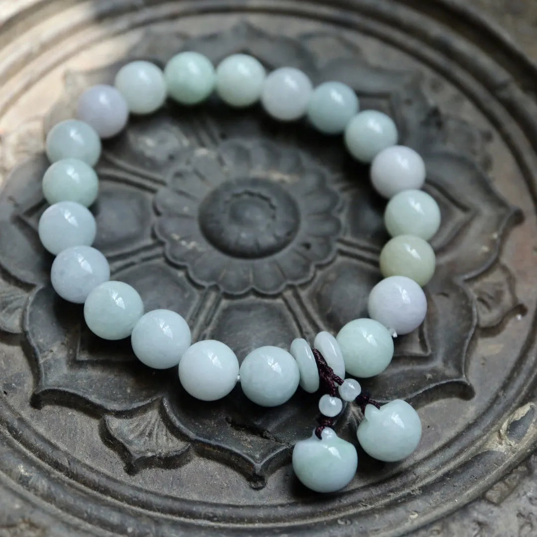 Natural jade bracelet with Maitreya Buddha and prosperity charm pendants