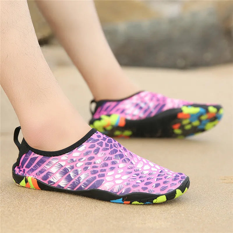 Blue leak-proof beach wading shoes with Lycra upper for men and women on a sandy background