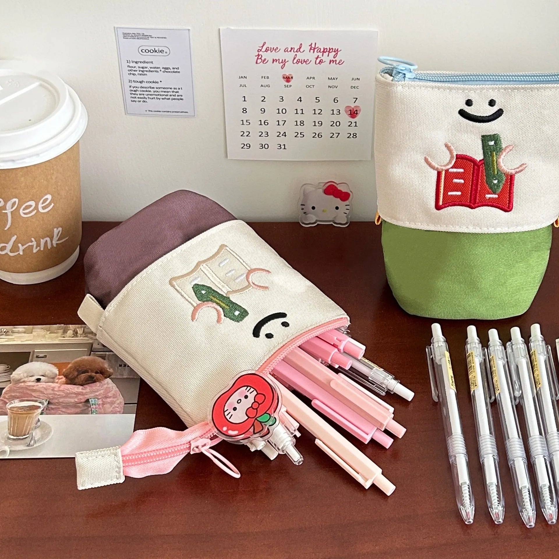 Brown collapsible pencil case with cartoon design, shown open and closed