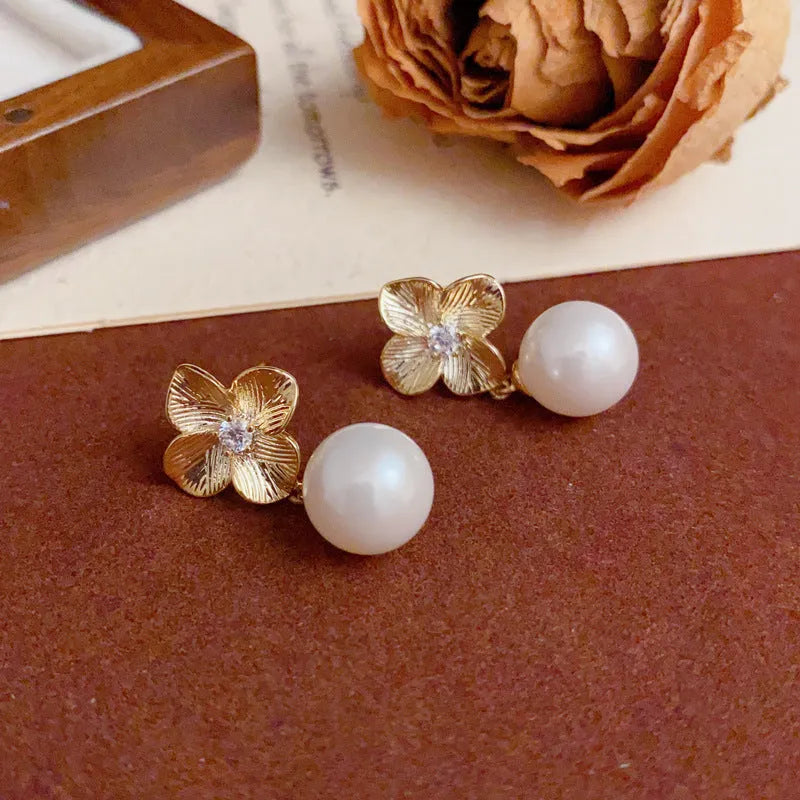 Women's gold plated copper floral drop earrings with faux pearl and metal petals simple style