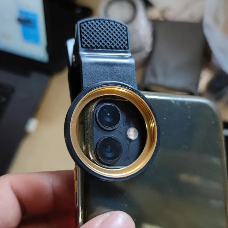 37mm universal clip phone lens filter adapter with golden or black spiral teeth and large hole for screw-on filters.