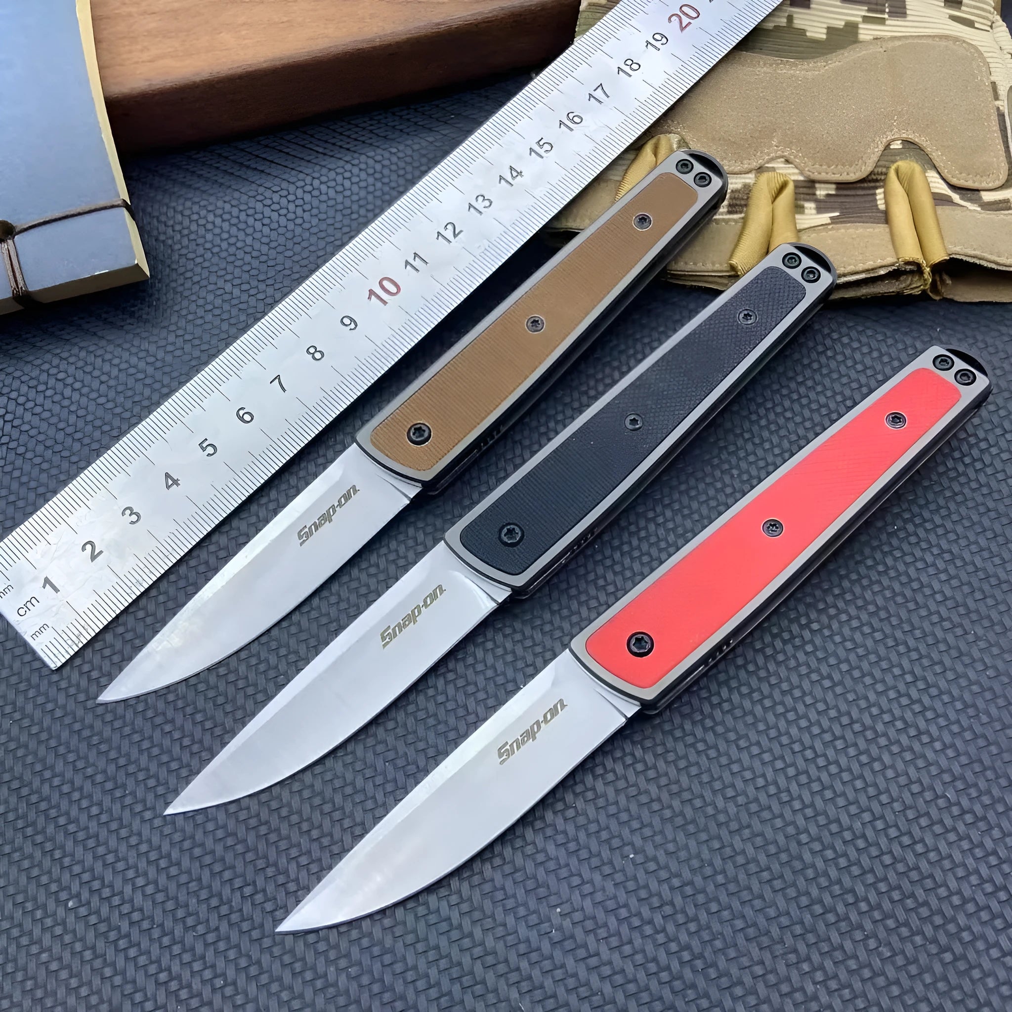 Folding fruit knife with stainless steel blade in black, coffee, or red colour options showing extended and closed positions