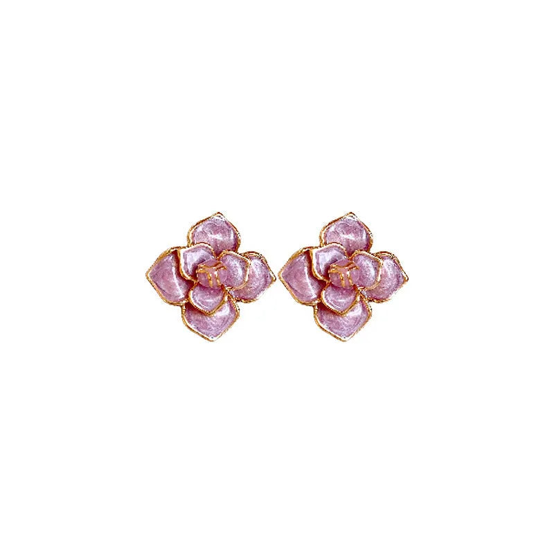Gold plated purple oil-spot glaze flower stud earrings on a white background, showing detailed petal design and matte finish.