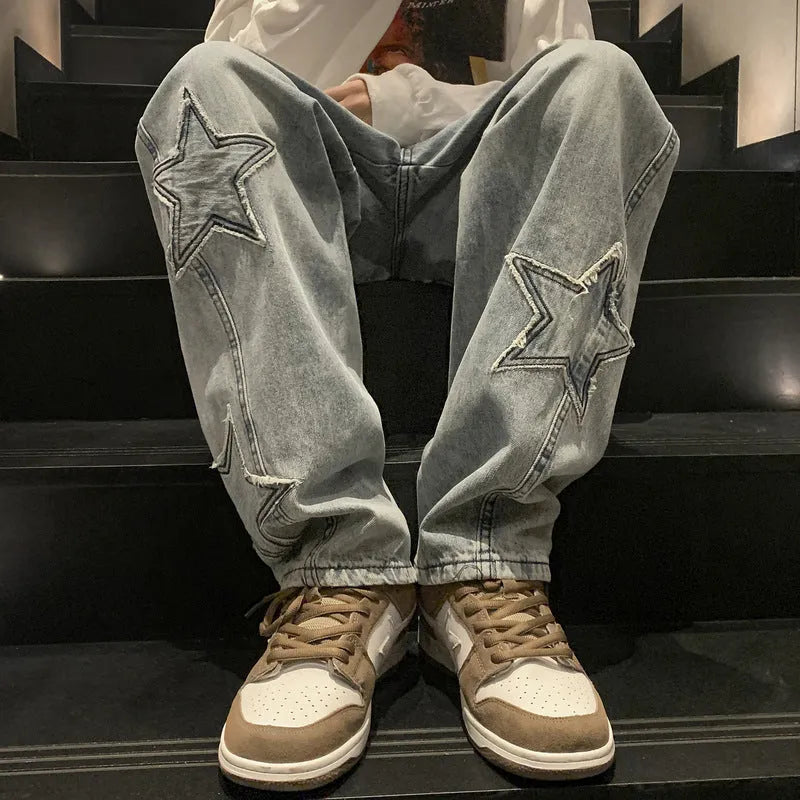 Loose fit cotton denim pants in stone washed light blue with straight leg, front view