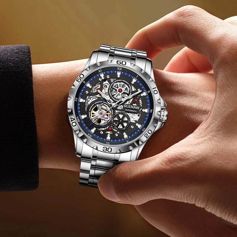 Men's silver automatic mechanical watch with hollow-out skeleton dial and luminous hands on coloured steel strap
