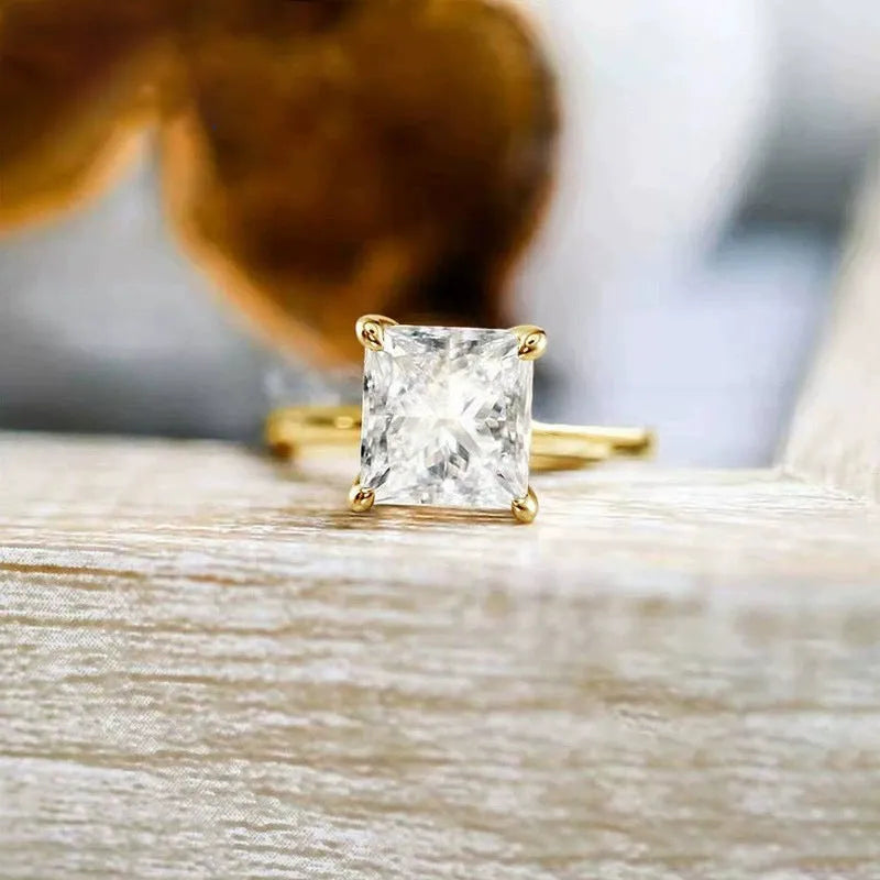 A simple geometric women's ring in 925 silver, shown in silver, gold, and rose gold colour options on a size chart.