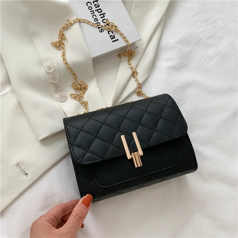 Women's minimalist crossbody bag with diamond lattice chain strap in black, green, or white.