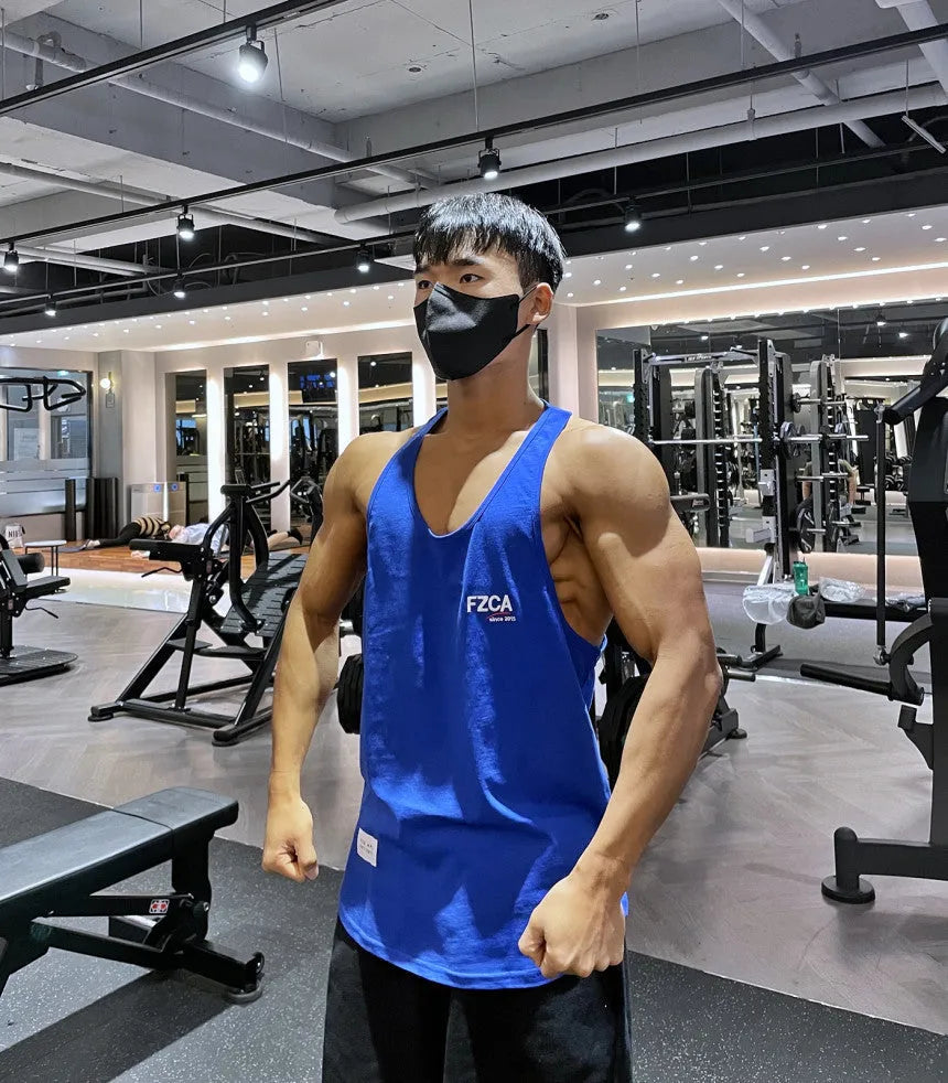 Men's cotton fitness vest in multiple colours for summer running and training.