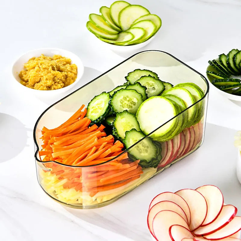 Transparent green vegetable cutter with stainless steel blades and 1.5L capacity container