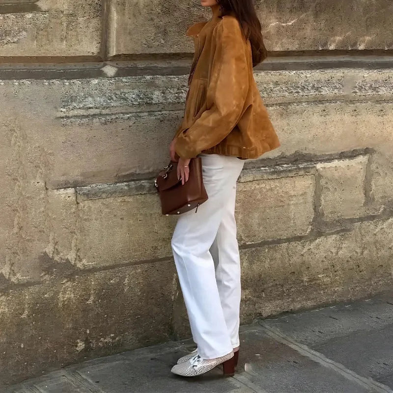 Retro solid colour loose-fit polyester jacket with long sleeves on a hanger.