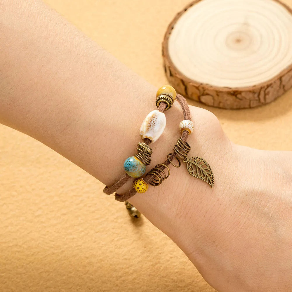Hand-woven cowhide rope bracelet with blue ceramic beads geometric splicing style