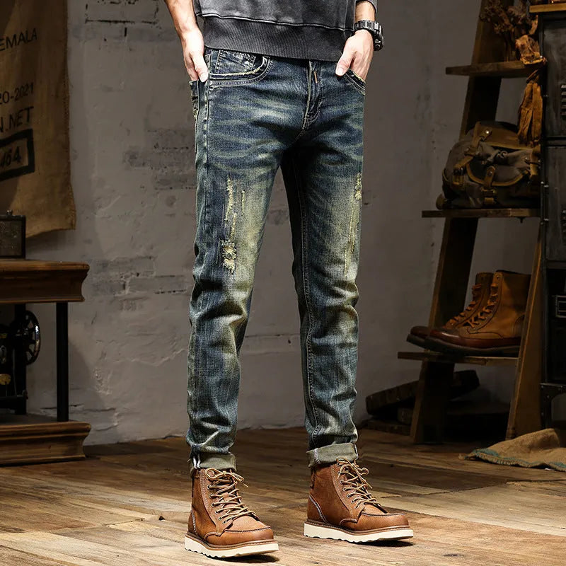 Men's slim-fit retro colour jeans with a zip fly, laid flat to show the skinny pant style.