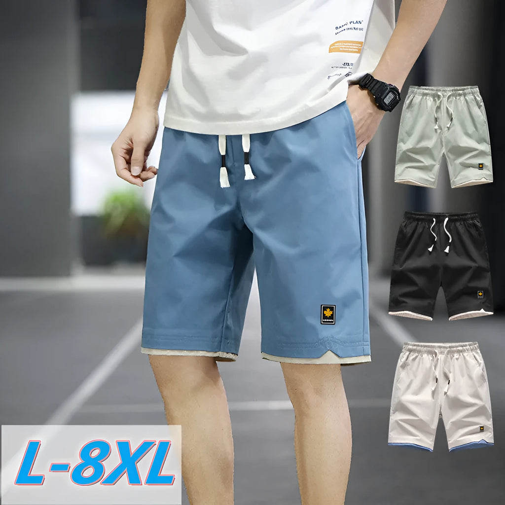 Casual loose straight-leg beach shorts on a plain background, shown in a green colour variant.