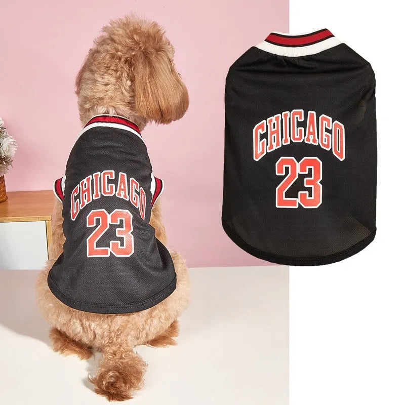 Mesh polyester dog basketball vest in black with basketball design, side view on a white background