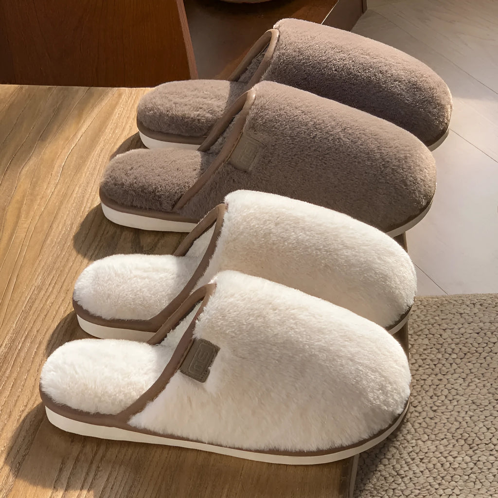Winter plush slippers in blue with non-slip PVC sole and car stitching detail on the upper.