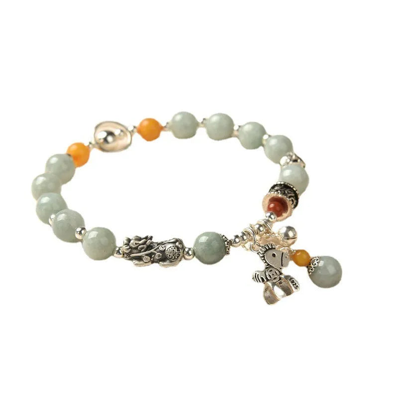 Natural jade vintage bracelet with alloy clasp on a white background.