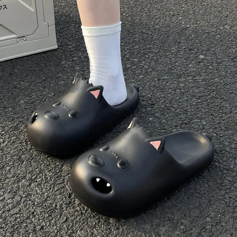 Women's black and white EVA foam puppy slippers with toe cap sandal design.