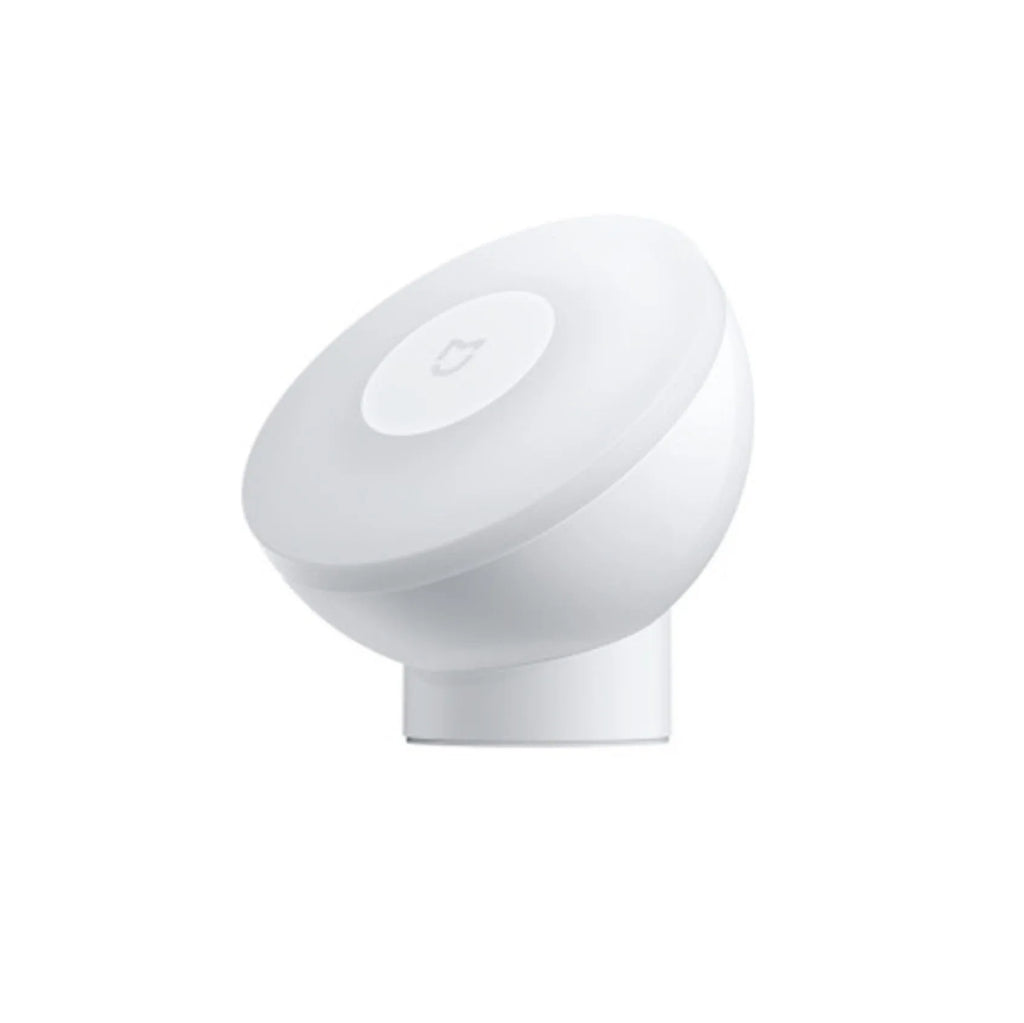 White Mijia Bluetooth bedside table lamp with human body induction on a wooden surface