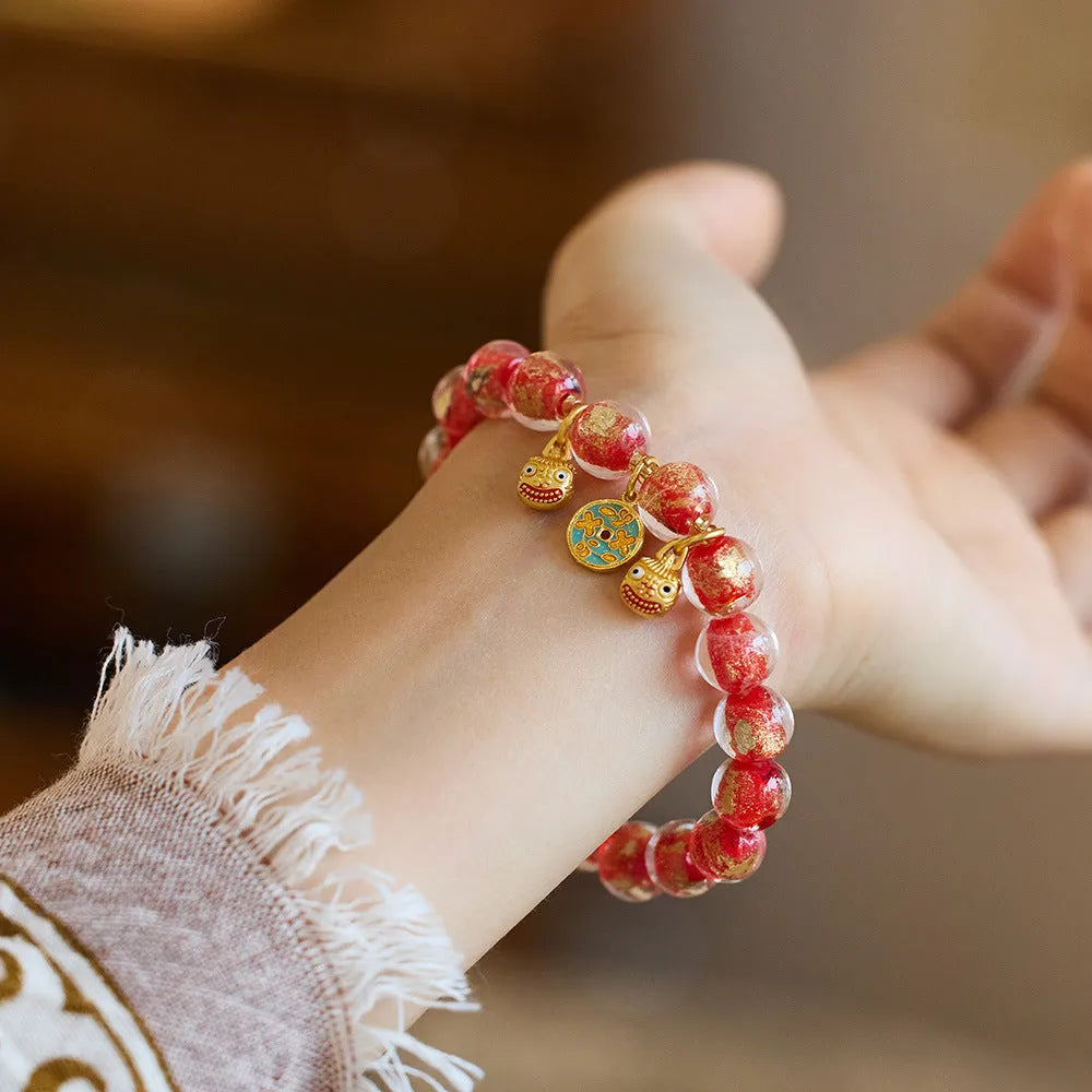 Handmade national style bracelet with fragrant grey gold foil coloured glaze swallowing gold beast geometric design