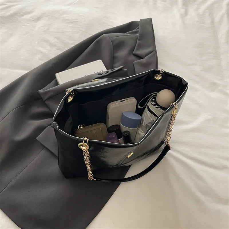 Large capacity chain shoulder bag for women in black, soft PU, horizontal square shape with chain strap