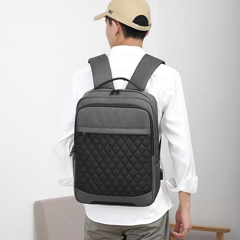 Men's solid colour Oxford cloth travel backpack with curved shoulder straps and diamond mesh detail