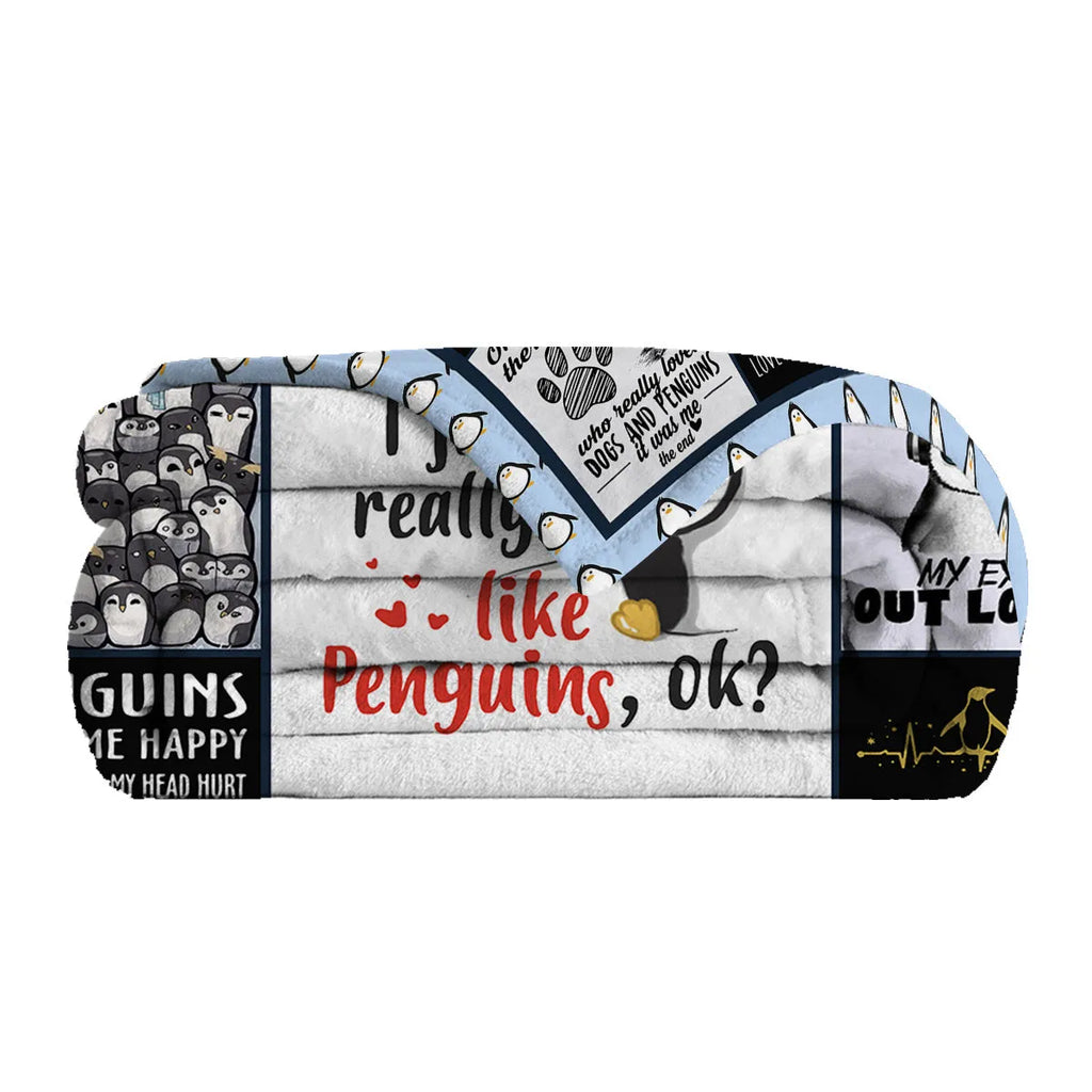 Multicoloured flannel throw blanket with penguin patterns, 130x150cm size on a sofa