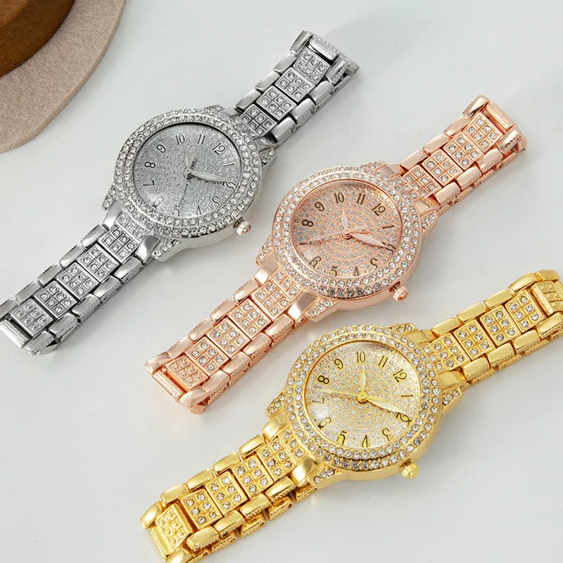 Women's starry rhinestone quartz analogue watch with gold Roman numeral dial and alloy bracelet
