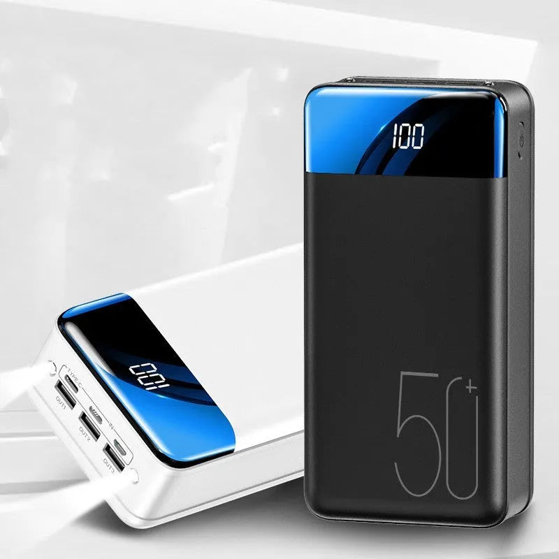 Black large capacity 50000mAh portable power bank with three USB output ports showing size scale.