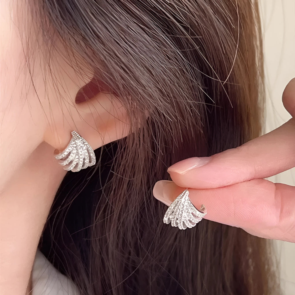 A pair of women's geometric drop earrings in a platinum colour, made from zircon with an electroplated finish.