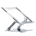 Grey aluminium laptop stand with adjustable angle, folded flat next to a laptop.