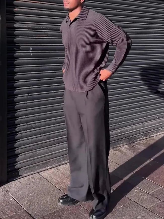 Black men's long-sleeved casual top with pleated detail on the sleeves.