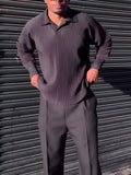 Black men's long-sleeved casual top with pleated detail on the sleeves.