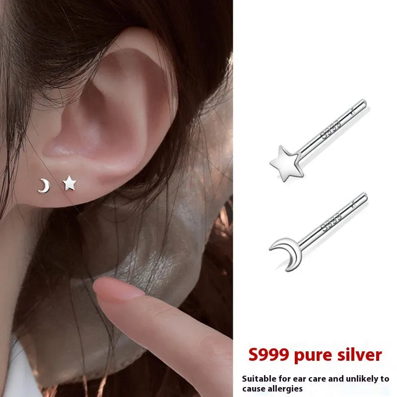 999 pure silver anti-blocking ear studs in butterfly shape on white background