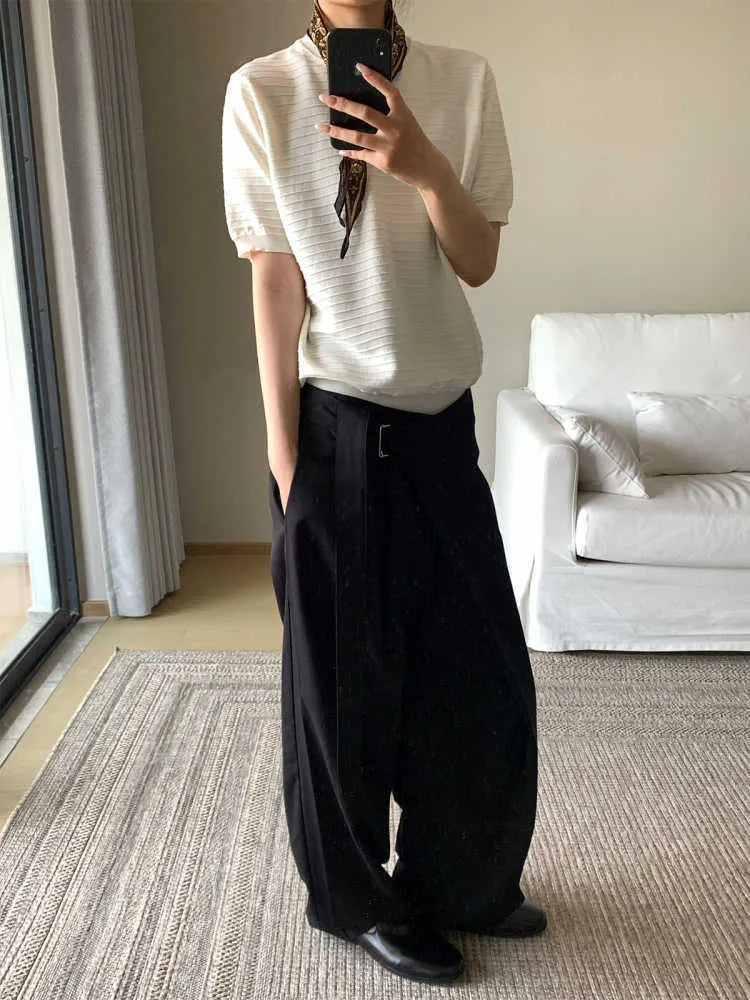 Black straight-leg trousers with a single pleat and adjustable waistband laid flat.