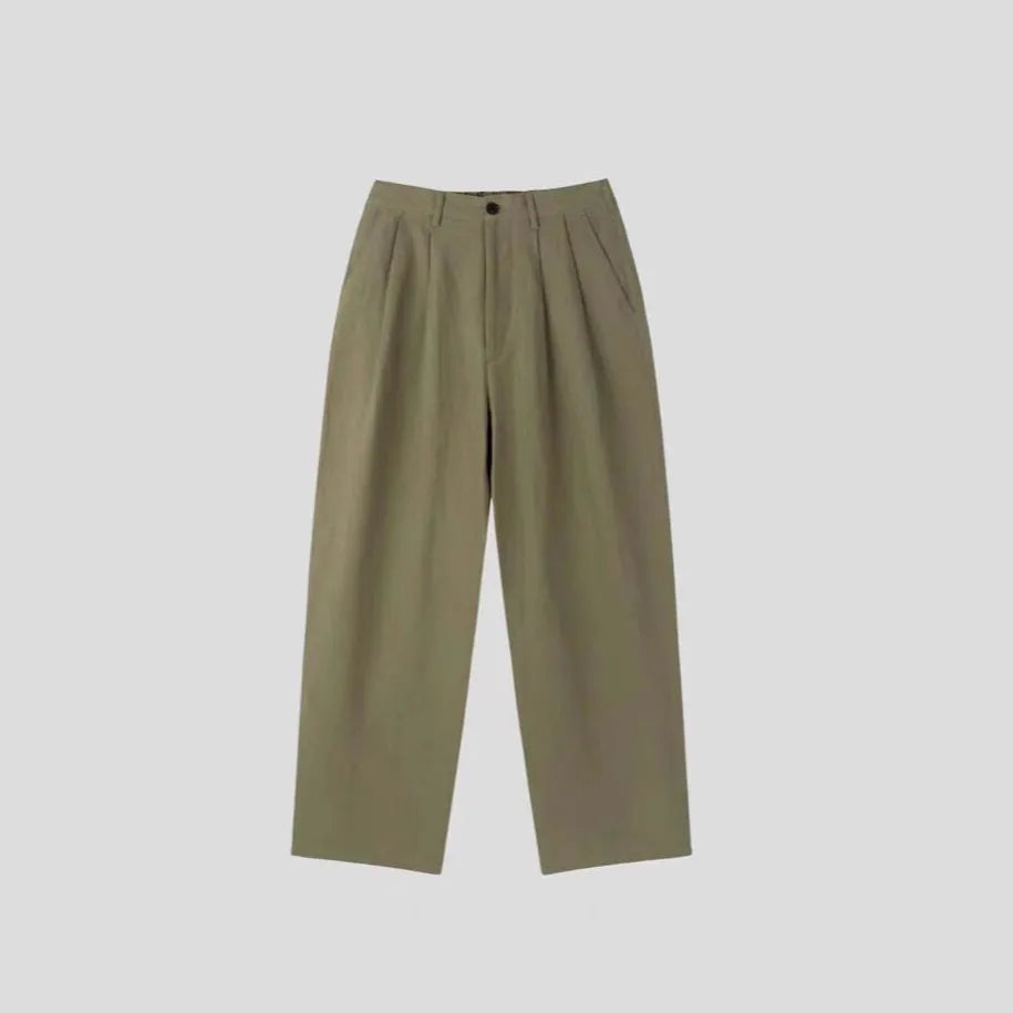 Men's loose-fit apricot coloured cotton linen blend trousers with a straight leg and elastic waistband.